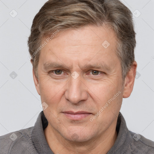 Joyful white middle-aged male with short  brown hair and brown eyes