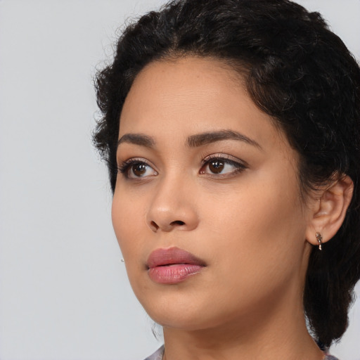 Neutral latino young-adult female with short  black hair and brown eyes