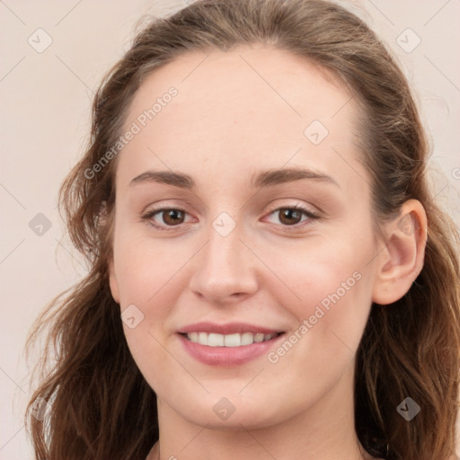 Joyful white young-adult female with long  brown hair and blue eyes