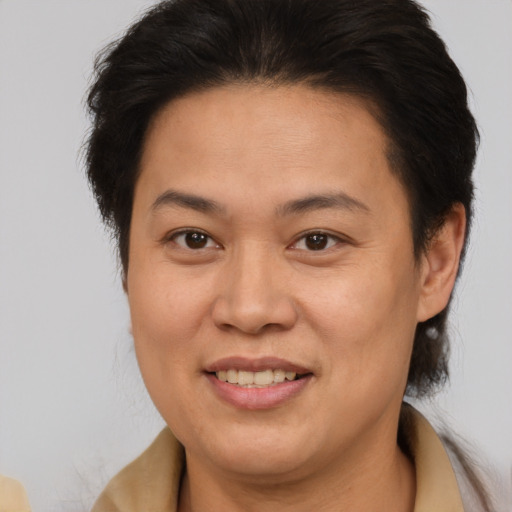 Joyful white adult female with medium  brown hair and brown eyes
