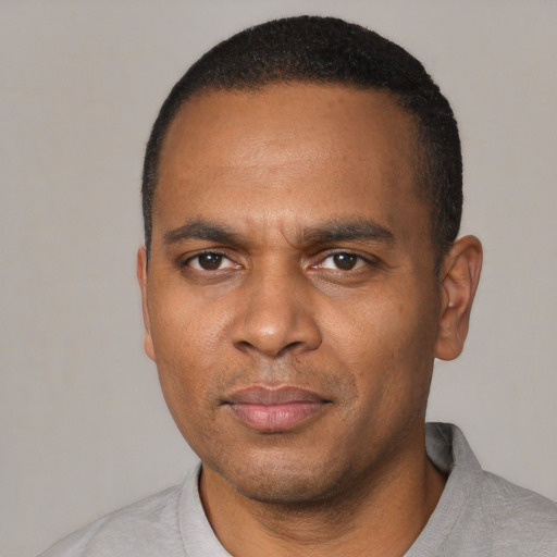 Neutral black young-adult male with short  black hair and brown eyes