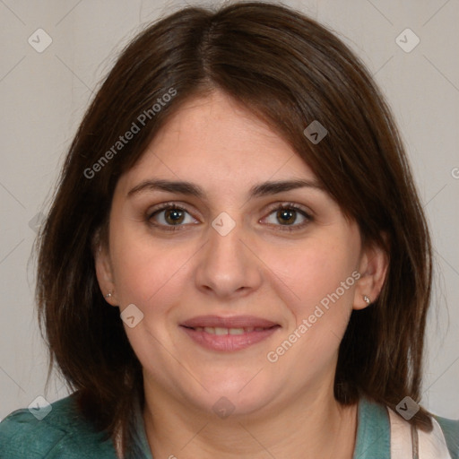 Joyful white adult female with medium  brown hair and brown eyes