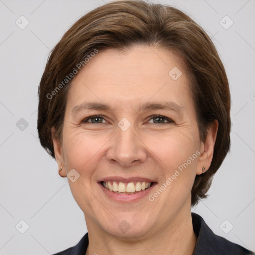 Joyful white adult female with medium  brown hair and grey eyes