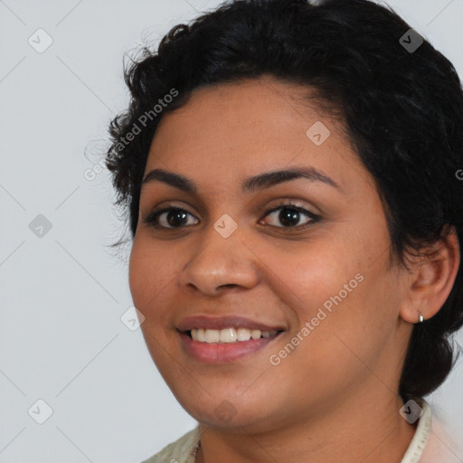 Joyful latino young-adult female with medium  brown hair and brown eyes