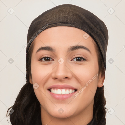 Joyful white young-adult female with long  black hair and brown eyes