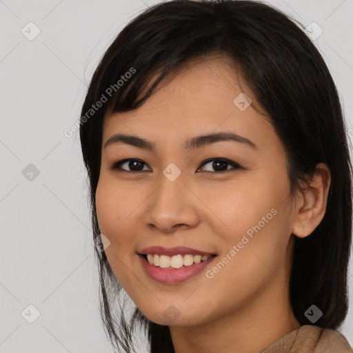 Joyful asian young-adult female with medium  black hair and brown eyes