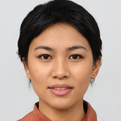 Joyful asian young-adult female with medium  black hair and brown eyes