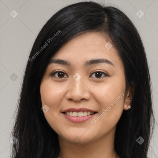 Joyful asian young-adult female with long  brown hair and brown eyes