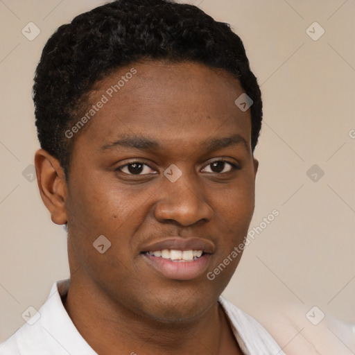 Joyful black young-adult male with short  brown hair and brown eyes