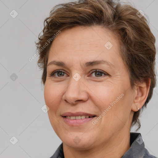 Joyful white adult female with short  brown hair and brown eyes