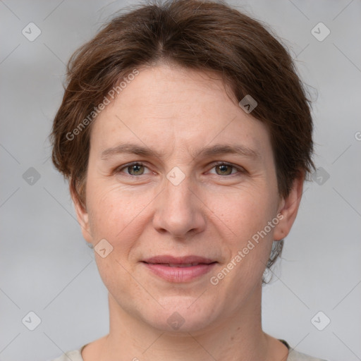 Joyful white adult female with short  brown hair and grey eyes