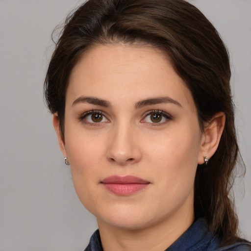 Joyful white young-adult female with medium  brown hair and brown eyes