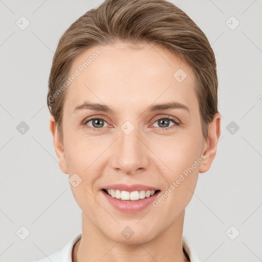 Joyful white young-adult female with short  brown hair and grey eyes