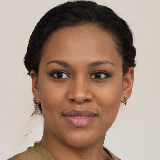 Joyful black young-adult female with short  brown hair and brown eyes