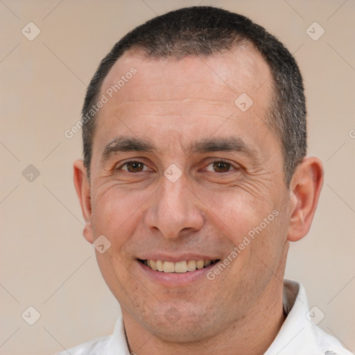 Joyful white adult male with short  brown hair and brown eyes