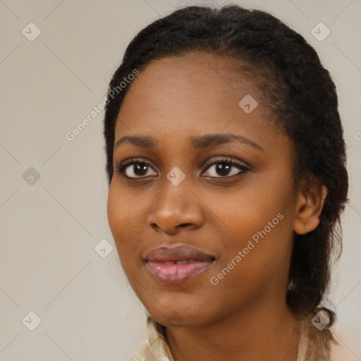 Joyful black young-adult female with long  brown hair and brown eyes