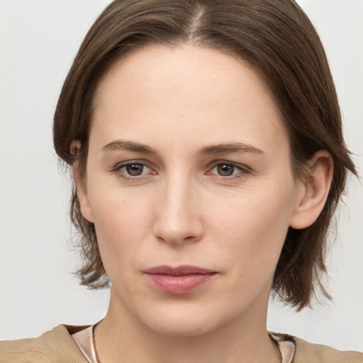 Neutral white young-adult female with medium  brown hair and grey eyes