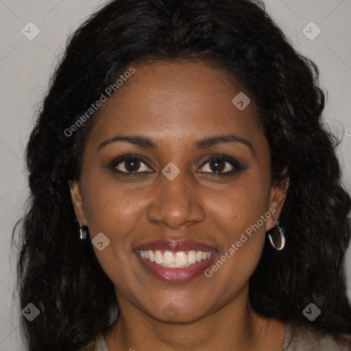 Joyful black young-adult female with long  brown hair and brown eyes