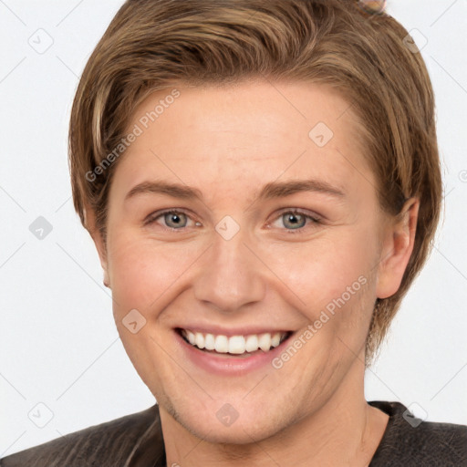 Joyful white young-adult female with short  brown hair and grey eyes