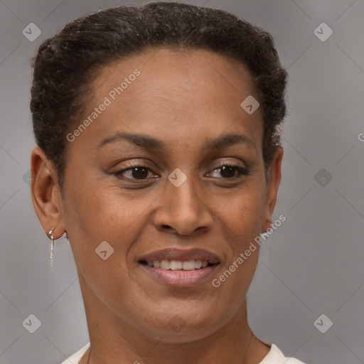 Joyful black adult female with short  brown hair and brown eyes