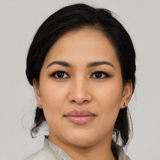 Joyful asian young-adult female with medium  black hair and brown eyes