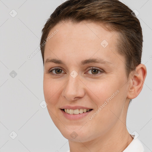 Joyful white young-adult female with short  brown hair and brown eyes