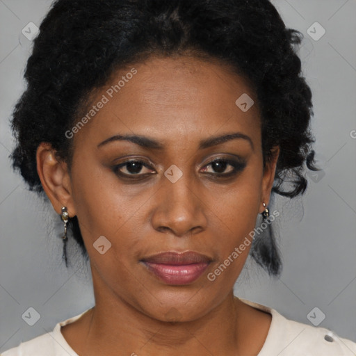 Joyful black adult female with short  brown hair and brown eyes