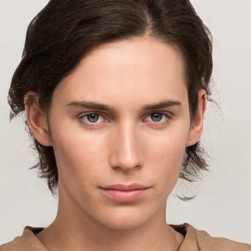 Neutral white young-adult female with medium  brown hair and grey eyes