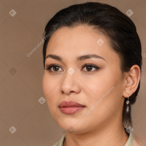 Joyful latino young-adult female with medium  brown hair and brown eyes