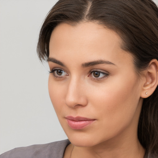 Neutral white young-adult female with medium  brown hair and brown eyes