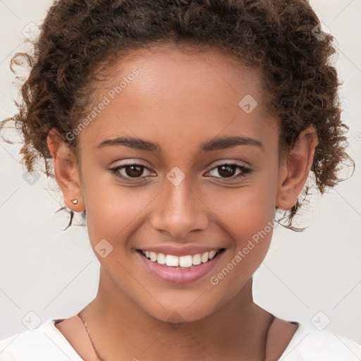 Joyful white child female with short  brown hair and brown eyes