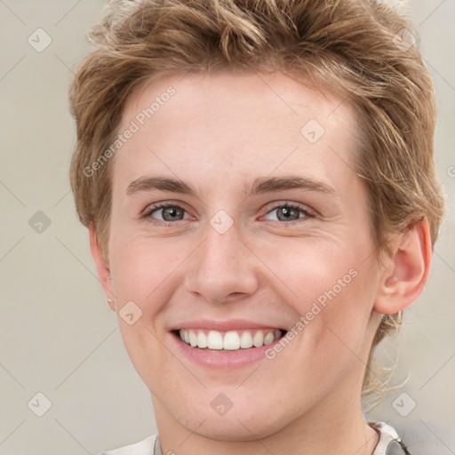 Joyful white young-adult female with short  brown hair and grey eyes