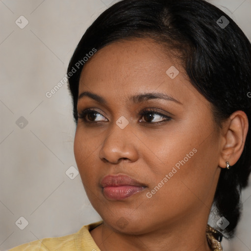 Neutral black young-adult female with medium  brown hair and brown eyes