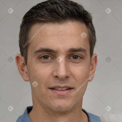 Joyful white adult male with short  brown hair and brown eyes