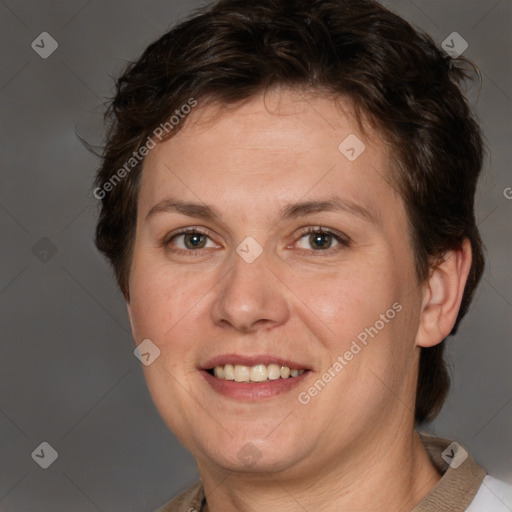 Joyful white adult female with short  brown hair and grey eyes