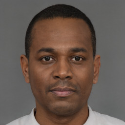 Neutral black young-adult male with short  black hair and brown eyes