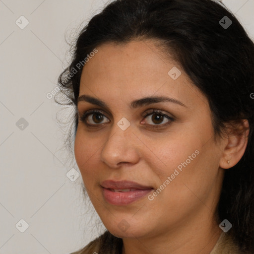 Joyful latino young-adult female with long  brown hair and brown eyes