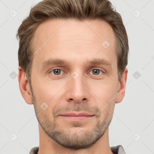 Joyful white adult male with short  brown hair and grey eyes