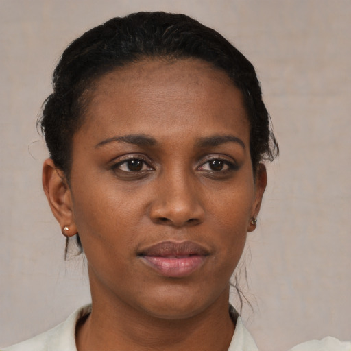 Neutral black young-adult female with short  black hair and brown eyes