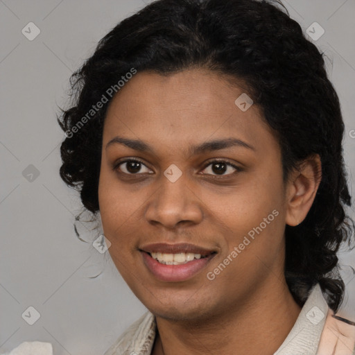 Joyful black young-adult female with long  black hair and brown eyes