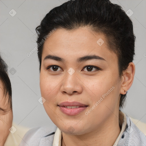 Joyful latino young-adult female with short  brown hair and brown eyes