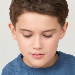 Joyful white child male with short  brown hair and brown eyes