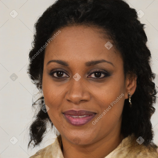 Joyful black adult female with medium  brown hair and brown eyes