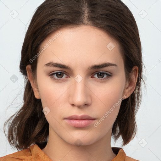 Neutral white young-adult female with medium  brown hair and brown eyes