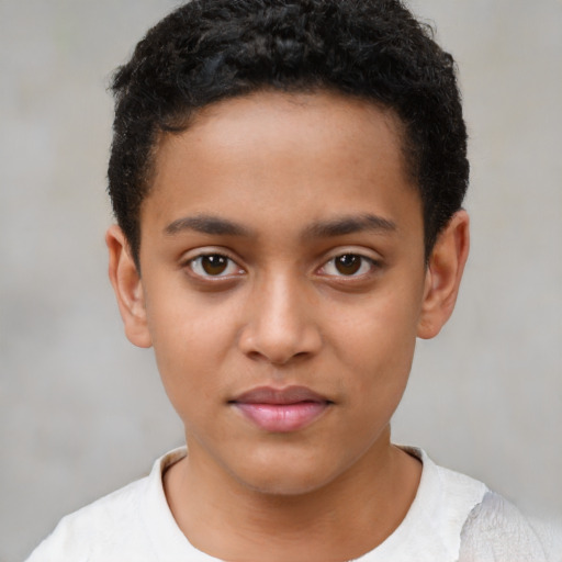 Joyful latino child male with short  brown hair and brown eyes