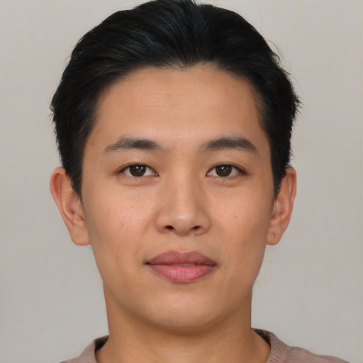 Joyful asian young-adult male with short  brown hair and brown eyes