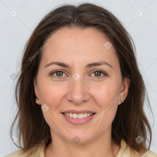 Joyful white adult female with medium  brown hair and brown eyes