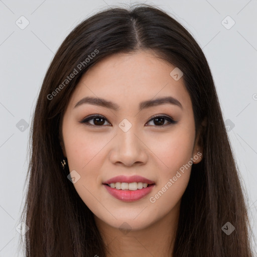 Joyful asian young-adult female with long  brown hair and brown eyes