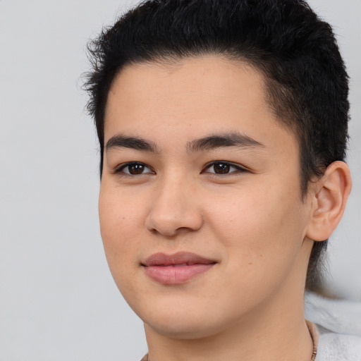 Joyful latino young-adult male with short  brown hair and brown eyes