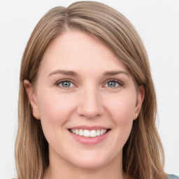 Joyful white young-adult female with long  brown hair and grey eyes